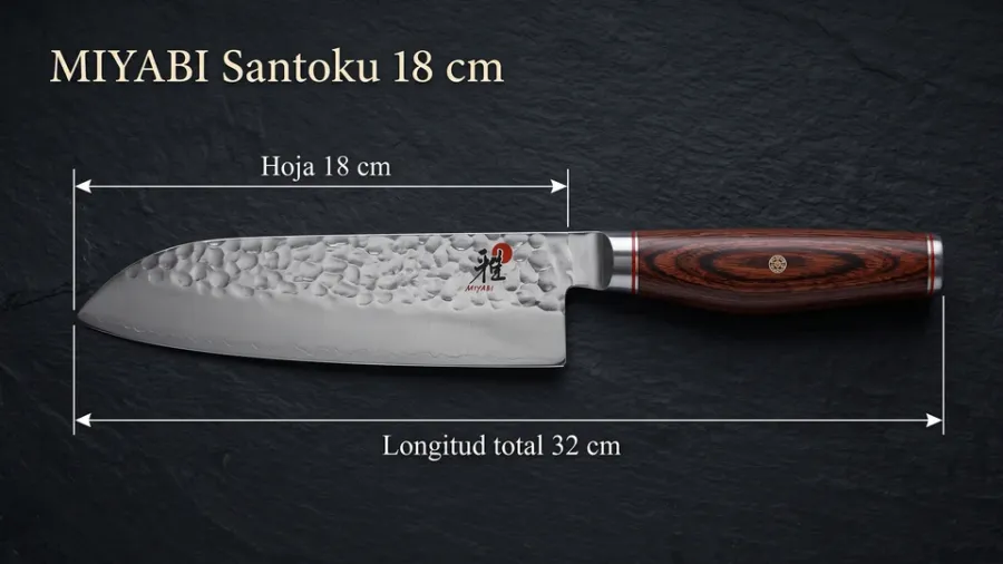 Medidas del Miyabi 6000MCT Santoku: hoja de 18 cm sobre 32 cm de longitud total, acotadas sobre pizarra gris